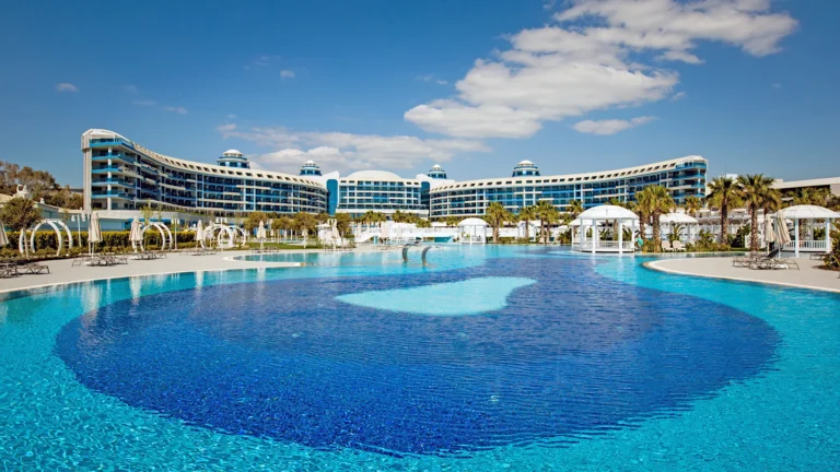 Sueno Hotels Deluxe Belek | Main Pool and the Hotel